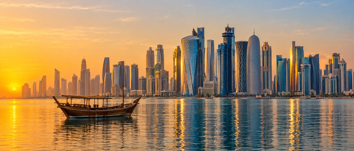 Doha skyline at sunset with a traditional dhow boat