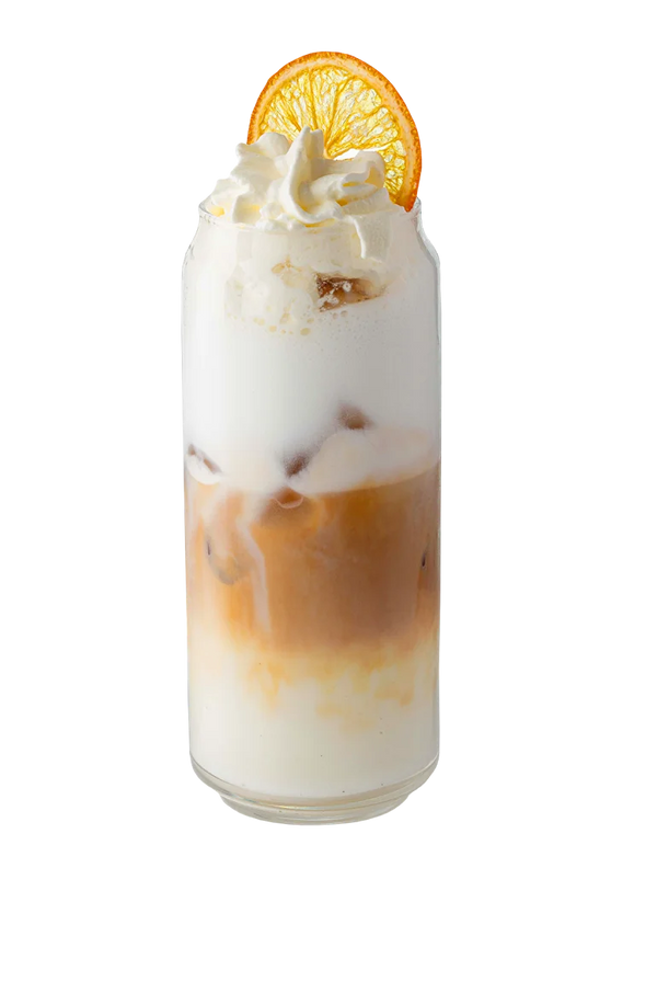 The Base Cream Latte layered drink with whipped cream and dried orange garnish